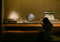 black desk globe on brown wooden desk